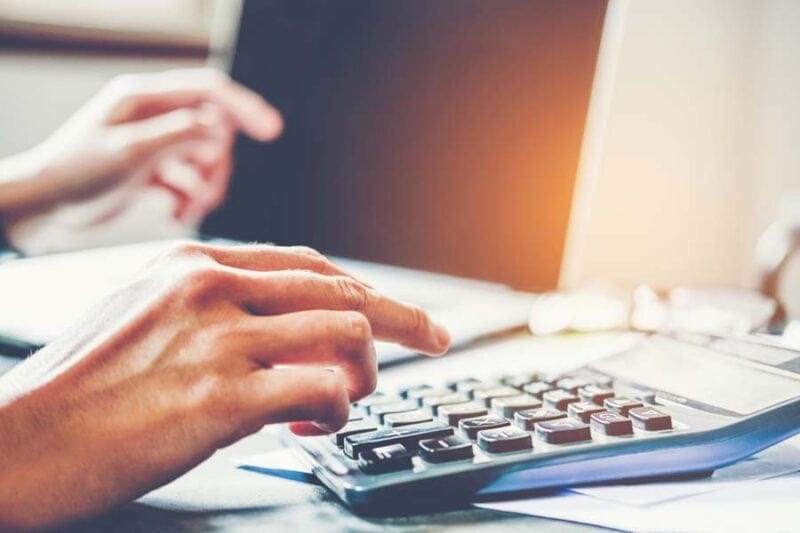 Person Calculating Cost of their new ac unit in Boca Raton