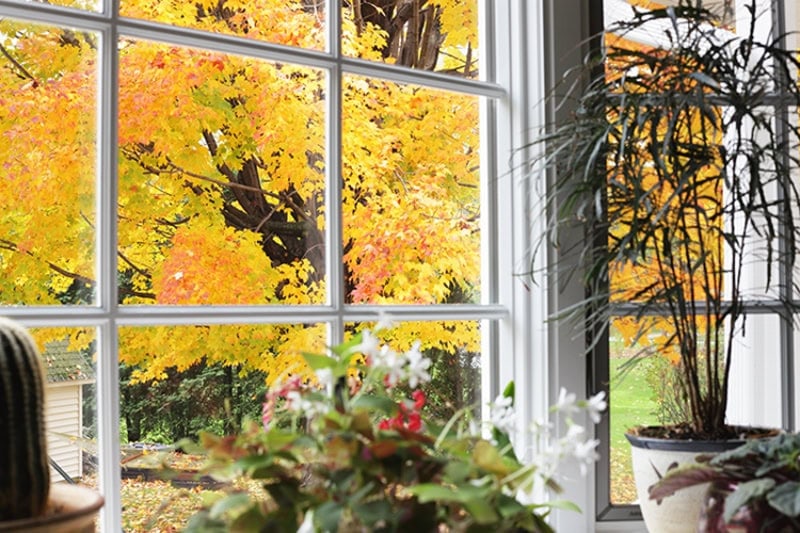 Fall background through a cozy home window.