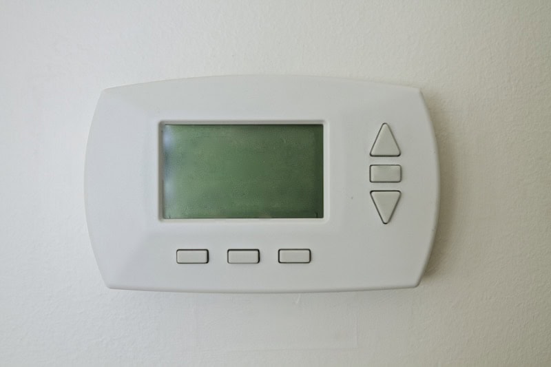 Why Is My Thermostat Blank? Thermostat mounted on a white wall.